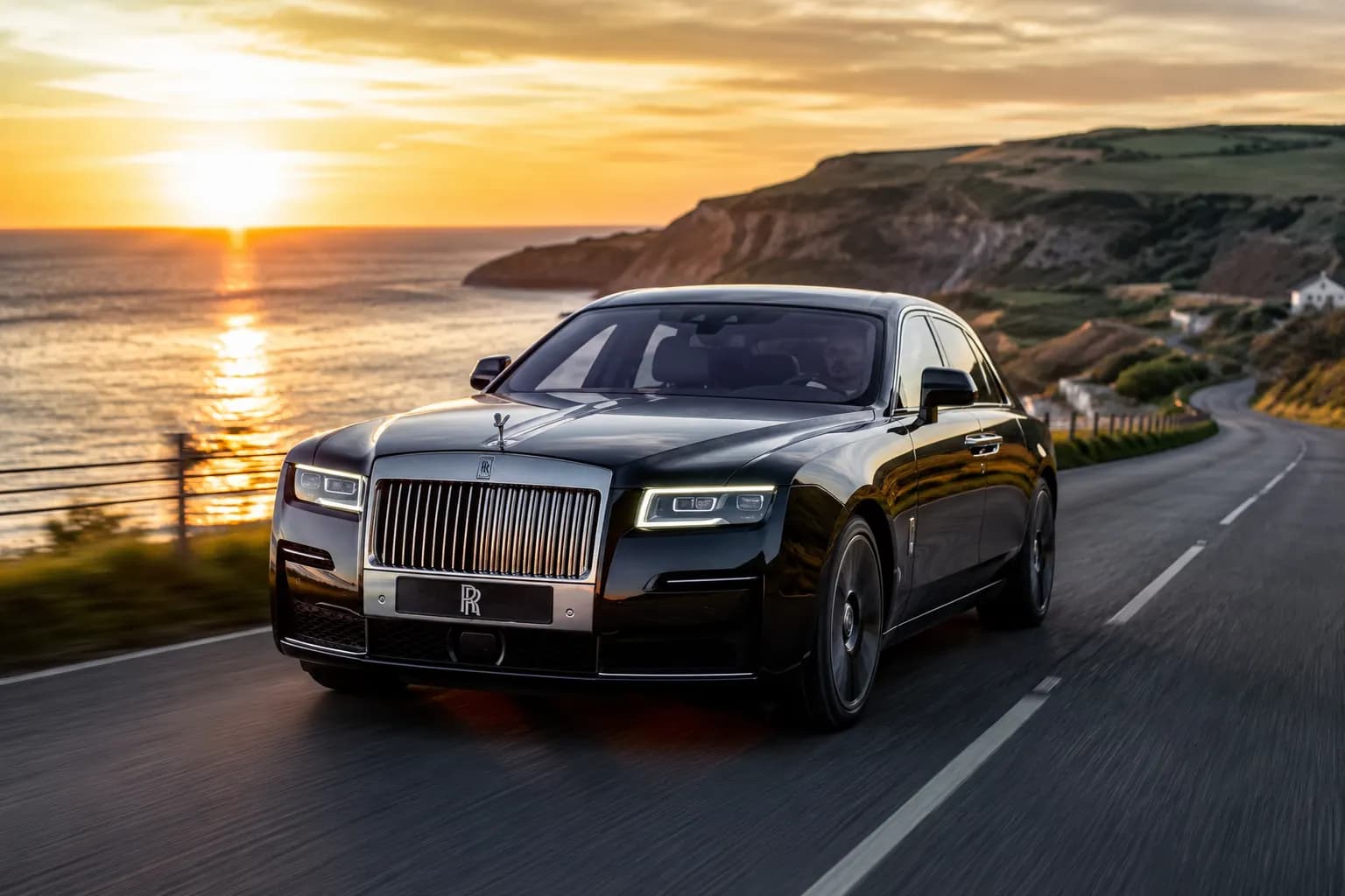 Executive chauffeur opening a luxury car for chauffeur services in Rossendale